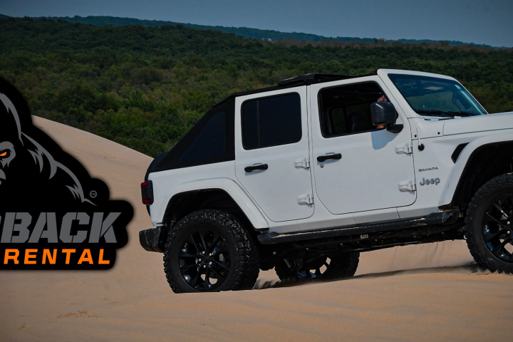 a truck cake sitting on top of a car