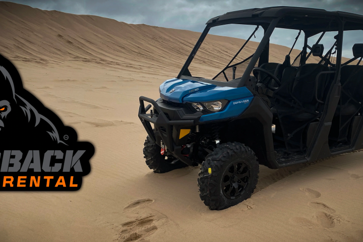 a truck cake sitting on top of a car